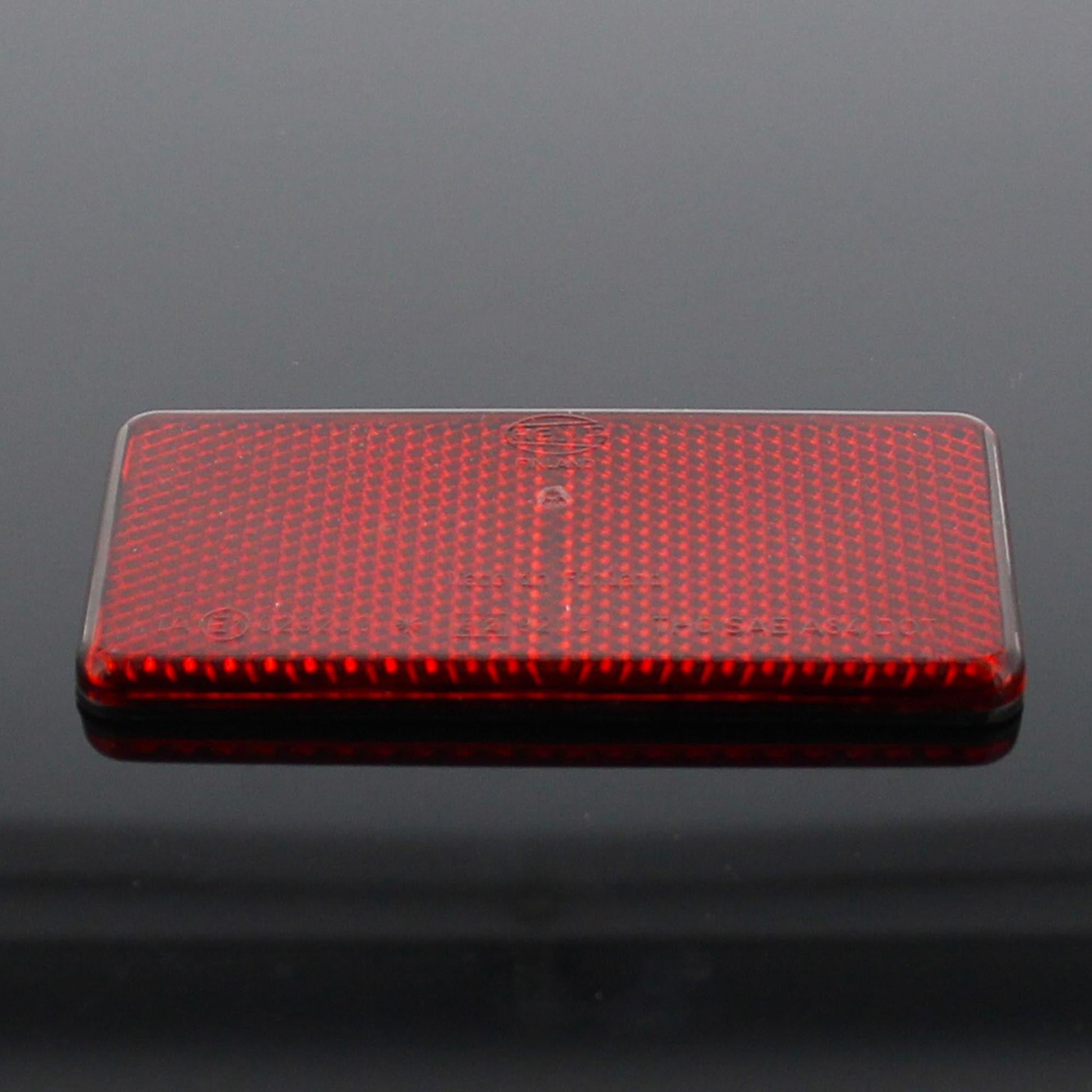 Hella Rückstrahler Rot Selbstklebend 94x44x6,5mm - TMN-shop.de