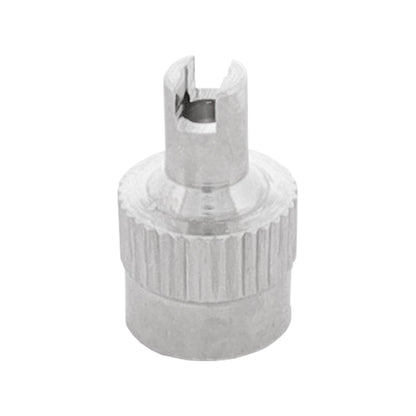 Metal valve cap with extractor